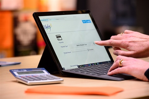 Lady using ipad on desk