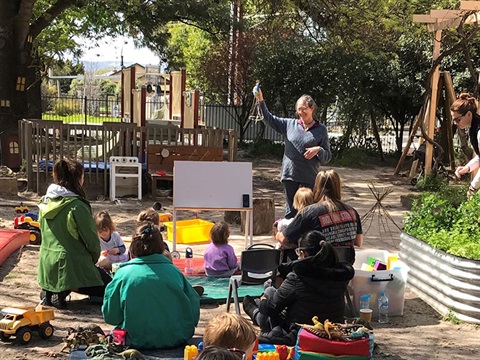 young families attending an outdoor workshop